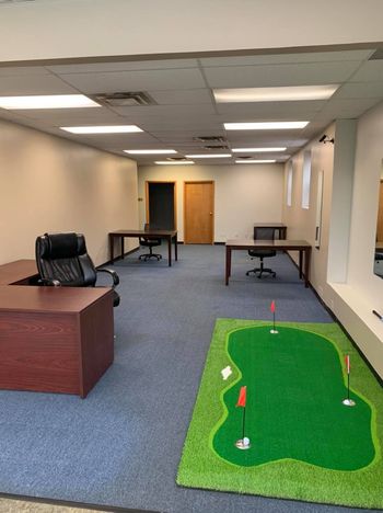 putting green, satellite office of Buffalo First Wealth Management